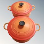 Two Le Creuset cast iron lidded twin handled pans.
