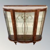 A mid-20th century walnut shaped front display cabinet.