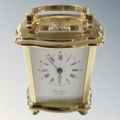 A good quality brass carriage clock by Woodford, with key.