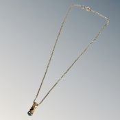 A 9ct yellow gold chain with synthetic aquamarine pendant. CONDITION REPORT: 5.3g.