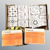 A box containing ceramic tiles, boxes of gloss white wool tiles etc.