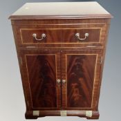 A Charles Sheraton audio cabinet in mahogany finish