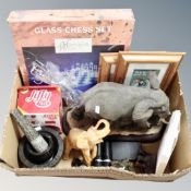 A box containing elephant ornaments, a glass chess set, marble pestles and mortars,