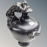 A bronze embossed twin handled urn (height 30cm)