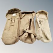 Three World War II military canvas pouches.