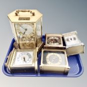Five assorted brass cased carriage and anniversary clocks with battery movements.