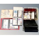 A box of six albums and folders containing world stamps and first day covers,