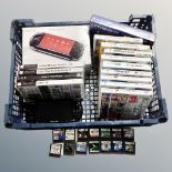 A basket containing a Sony PSP slim and lite, boxed, together with PSP and Nintendo DS games.