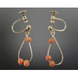 A pair of 9ct gold coral earrings with screw backs. CONDITION REPORT: 1.