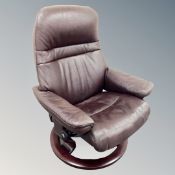A Stressless brown leather adjustable reclining armchair