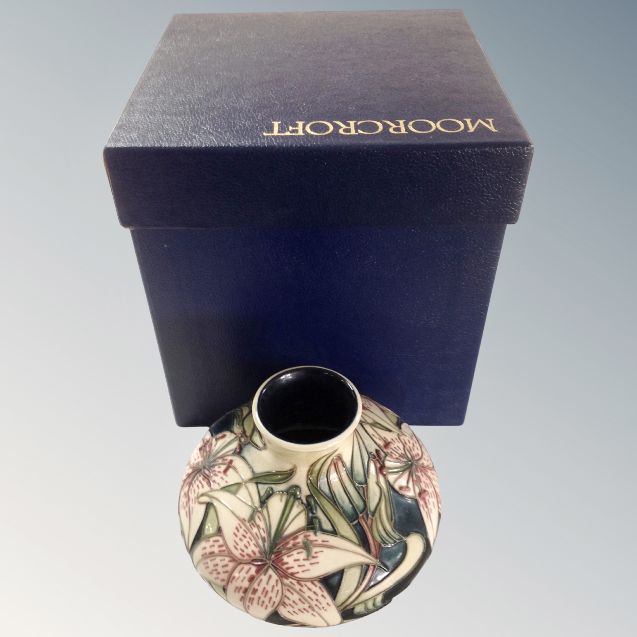 A modern Moorcroft squat vase, dated 2002, in original box.