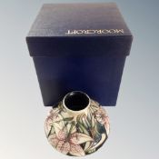 A modern Moorcroft squat vase, dated 2002, in original box.
