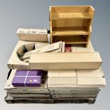 A pallet containing a quantity of boxed kitchen cabinet doors, round inset bowl tap,