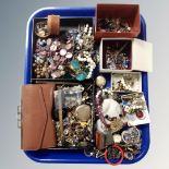 A tray containing assorted costume jewellery, some silver including a small engraved locket.
