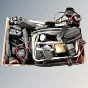 A camera bag containing Praktica Super TL camera, lenses, accessories, camera tripod etc.