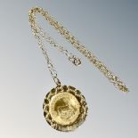 A 1/10oz fine gold Krugerrand in 9ct gold pendant setting on chain CONDITION REPORT: