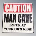 A cast iron wall plaque, man cave.