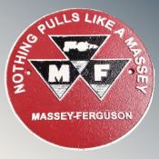 A cast iron wall plaque, Massey Ferguson.