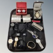 A tray containing hip flasks, Chinese medicine balls in box, gent's wristwatches including Casio,