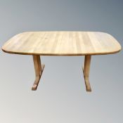 A late 20th century Danish extending pedestal dining table