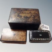 An antique Japanese lacquered cigar box together with 19th century snuff boxes.