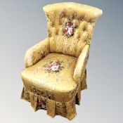 An early 20th century bedroom chair in golden fabric