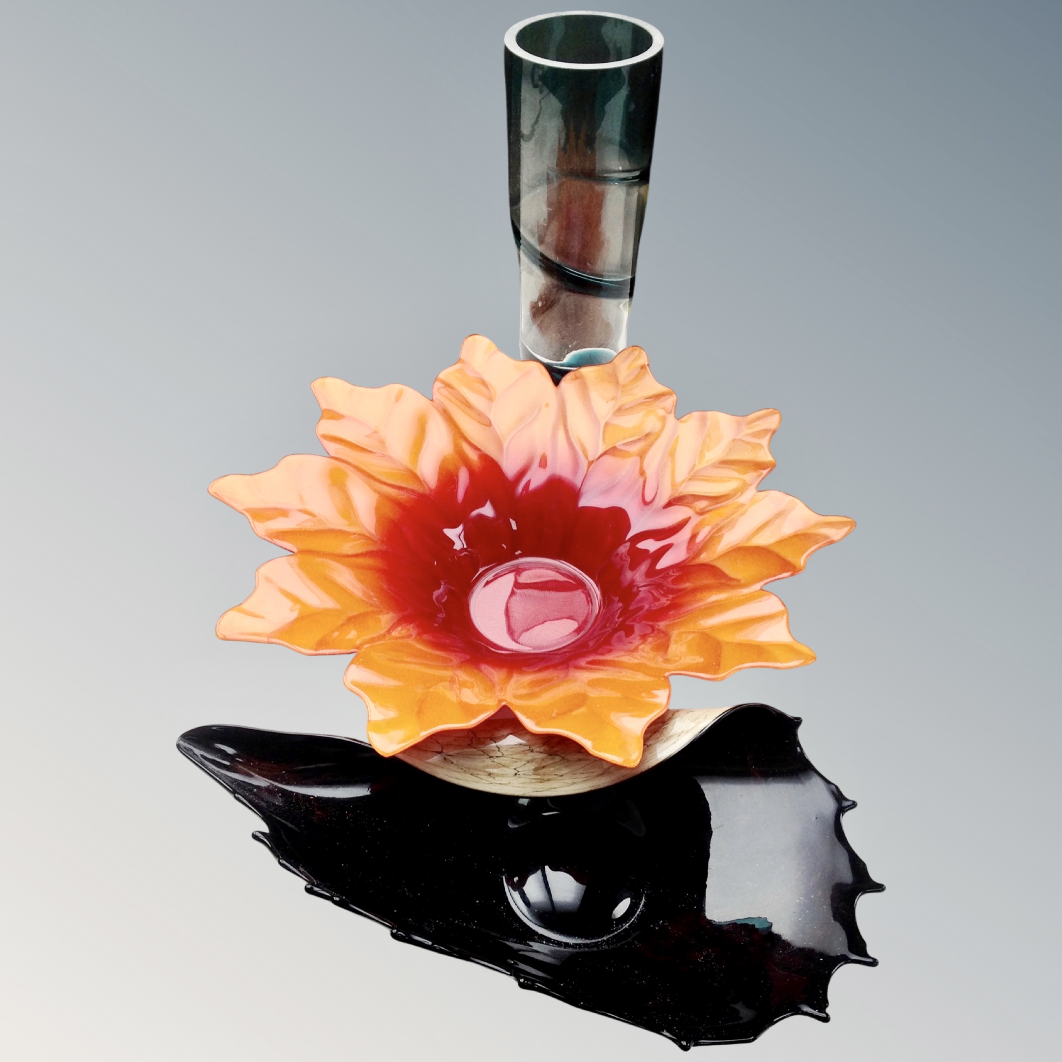 A studio two-tone twist patterned vase together with two further glass dishes, leaf and shell.