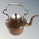 A Victorian copper kettle.