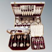 A Staffordshire canteen of cutlery together with two further canteens of matching spoons.