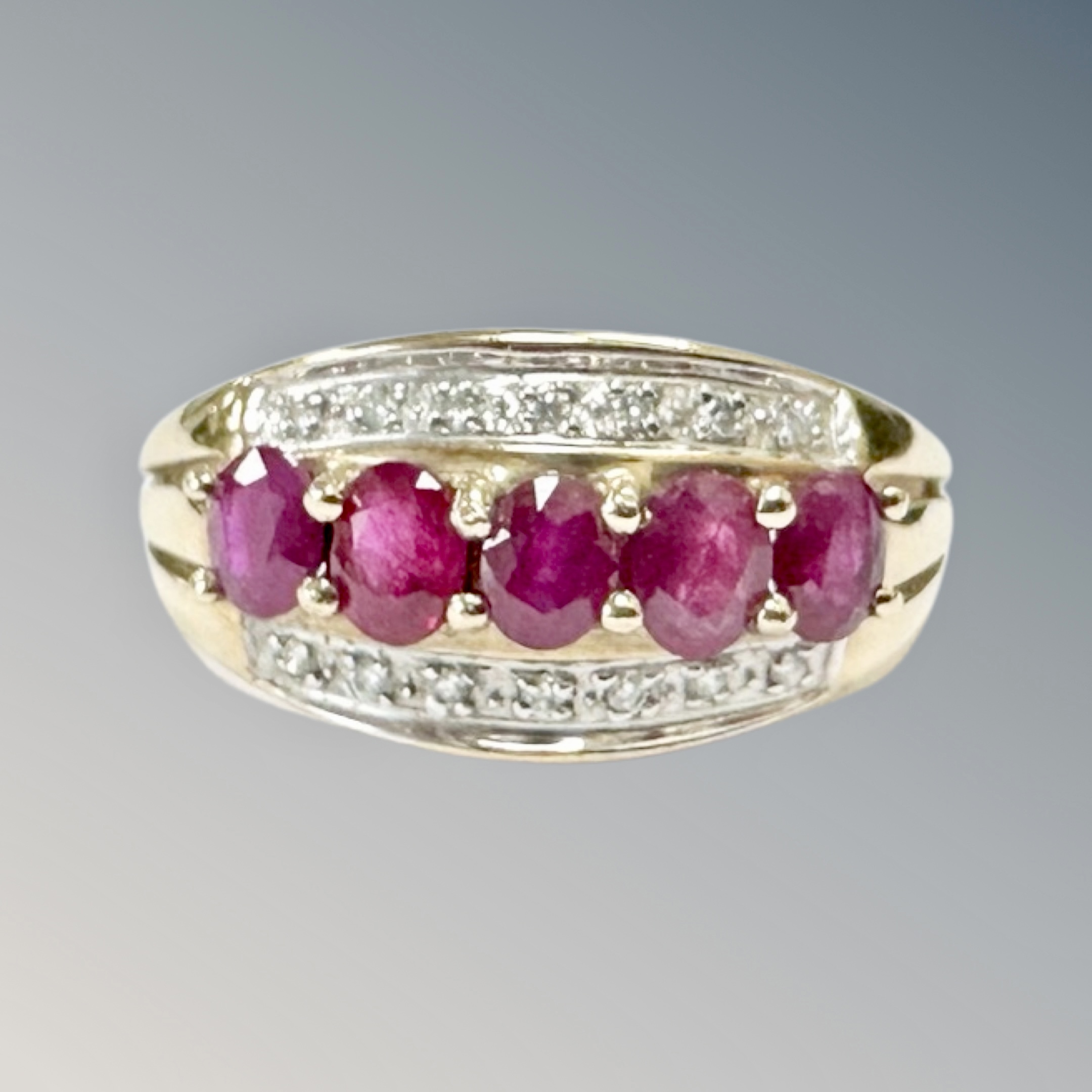 A 9ct gold ruby and diamond set ring, size M CONDITION REPORT: 2.