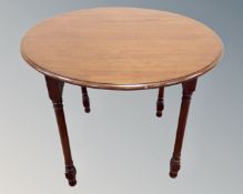 An antique mahogany circular table