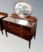 A 19th century inlaid mahogany four drawer dressing table together with matching double door linen