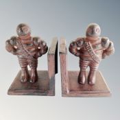 A pair of cast iron Michelin Man bookends.