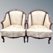 A pair of continental beech framed tub armchairs