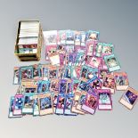 A tin containing a large quantity of Yu-Gi-Oh cards.