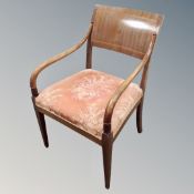 A 19th century continental inlaid mahogany and beech open armchair