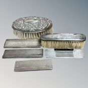 Two silver backed brushes together with four silver cased hair combs, weighable silver 79.6g.