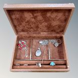 A jewellery box containing silver jewellery, engraved heart locket,