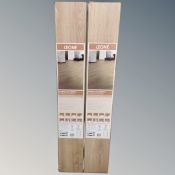 Six packs of Leona warm oak effect laminate flooring.