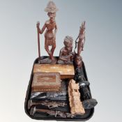 A tray containing Eastern tourist carvings and table boxes.