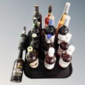 A tray containing 14 assorted bottles of port, Newcastle Brown Ale, strawberry kiwi cordial,