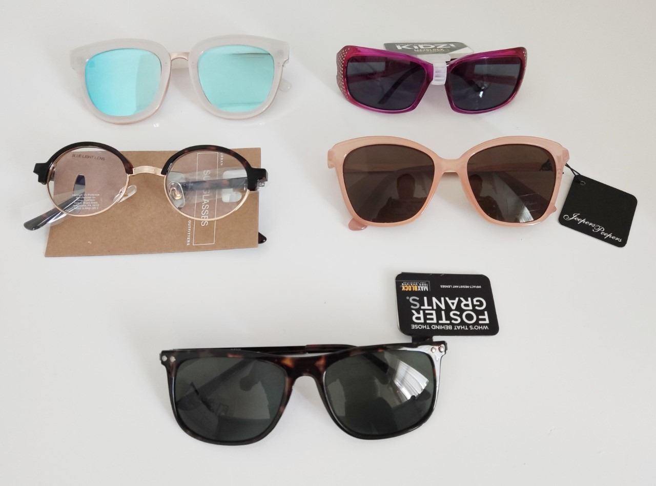 Collection of tagged designer sunglasses. Urban outfitters, Foster grants, and Jeepers peepers.