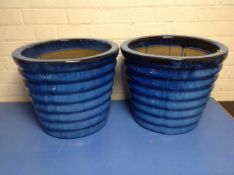 A pair of blue glazed ceramic garden planters,