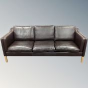 A Danish Stouby brown leather three seater settee