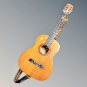 A Tatra classic acoustic guitar.