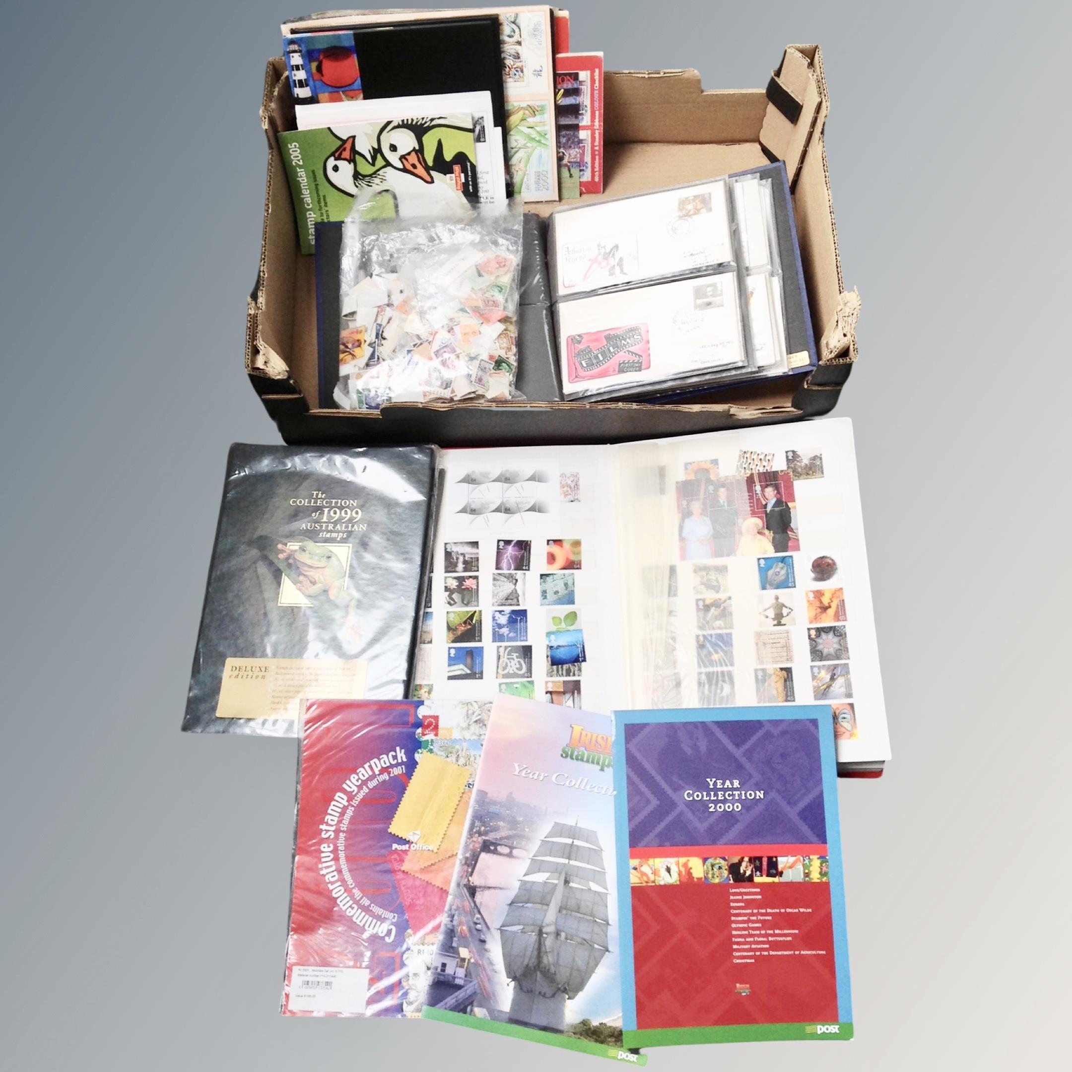 A box of stamp album containing hundreds of British stamps,