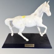 A Royal Doulton figure, Spirit of the Wind, on wooden plinth.