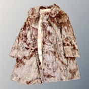 A vintage fur coat retailed by Jenners,