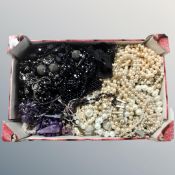 A small box of natural and faux pearls, mourning and amethyst jewellery.