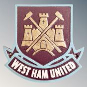 A cast iron wall plaque, West Ham United club crest.